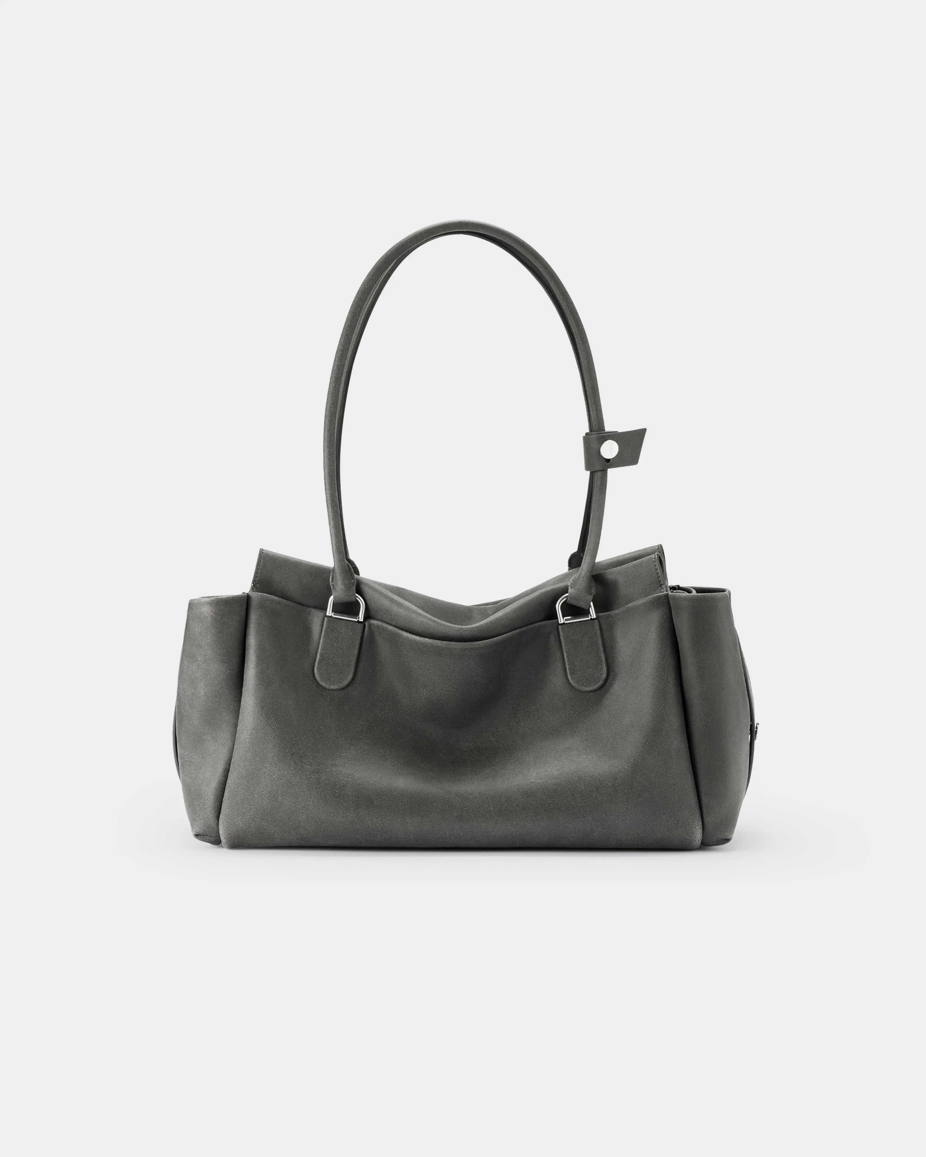 Back view of Cargo Maxi bag featuring the natural grain of distressed cowhide.