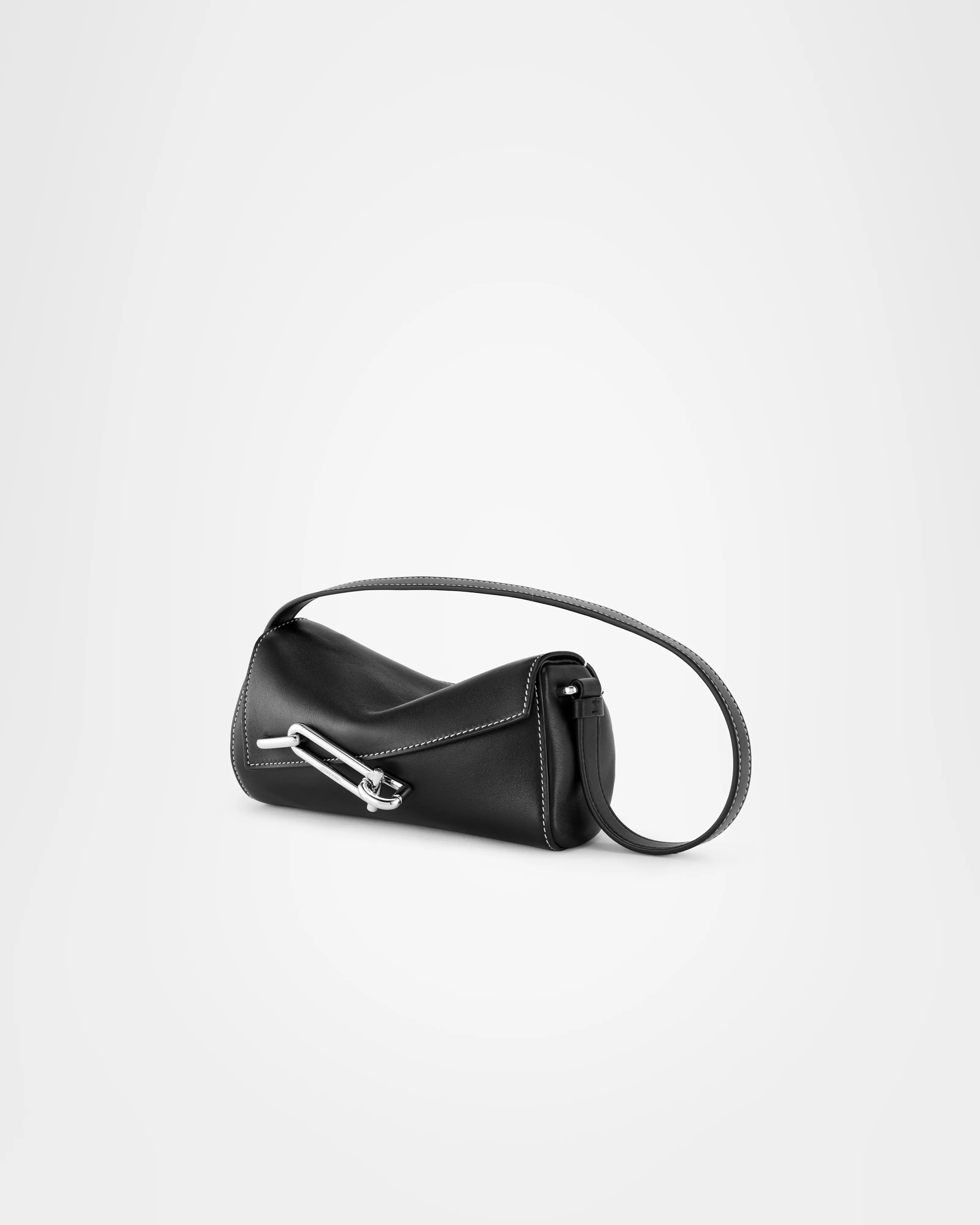 TAD-FAB-Softie-Mini-matte-black calfskin-shoulder-bag-side-view-with-silver-tone-carabiner-style-buckle